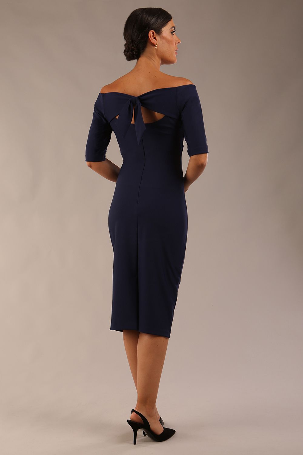 model wearing a diva catwalk Estonia Off shoulder Pencil Dress elbow length sleeve and knee length in navy blue colour