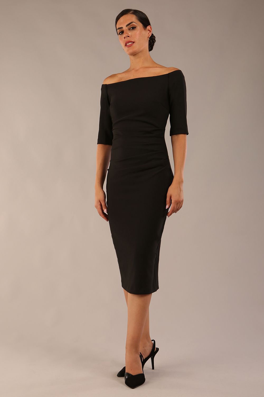 model wearing a diva catwalk Estonia Off shoulder Pencil Dress elbow length sleeve and knee length in black colour