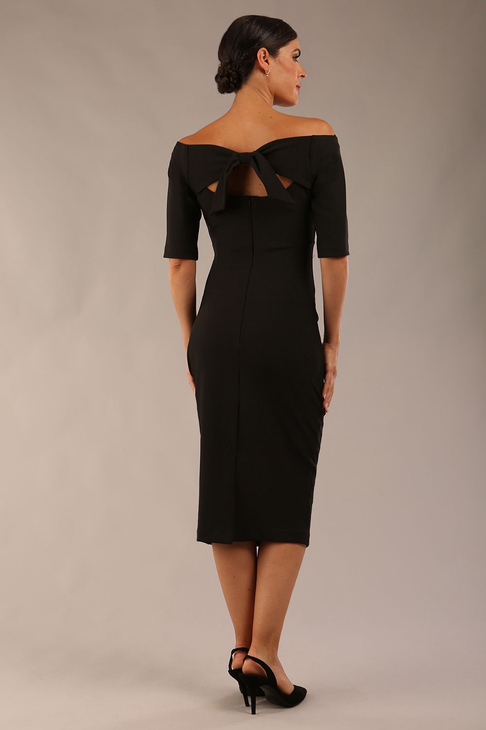 model wearing a diva catwalk Estonia Off shoulder Pencil Dress elbow length sleeve and knee length in black colour