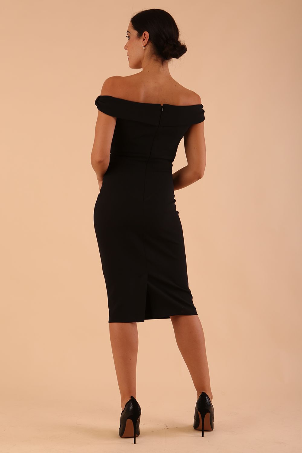 model wearing diva catwalk cloud pencil fitted flattering dress off shoulder sleeveless with detail with pleating around the front in black back