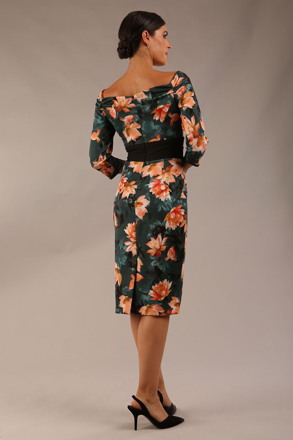 model wears Alpa Print off the shoulder pencil sheath Dress with long sleeves back image in waterlily print