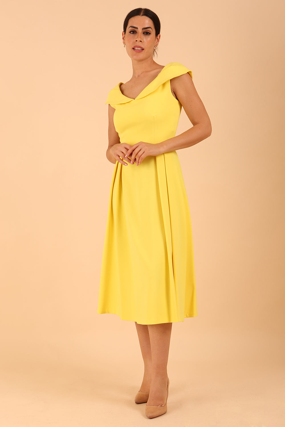 model is wearing divacatwalk Chesterton Sleeveless a-line swing dress in blazing yellow with oversized collar front