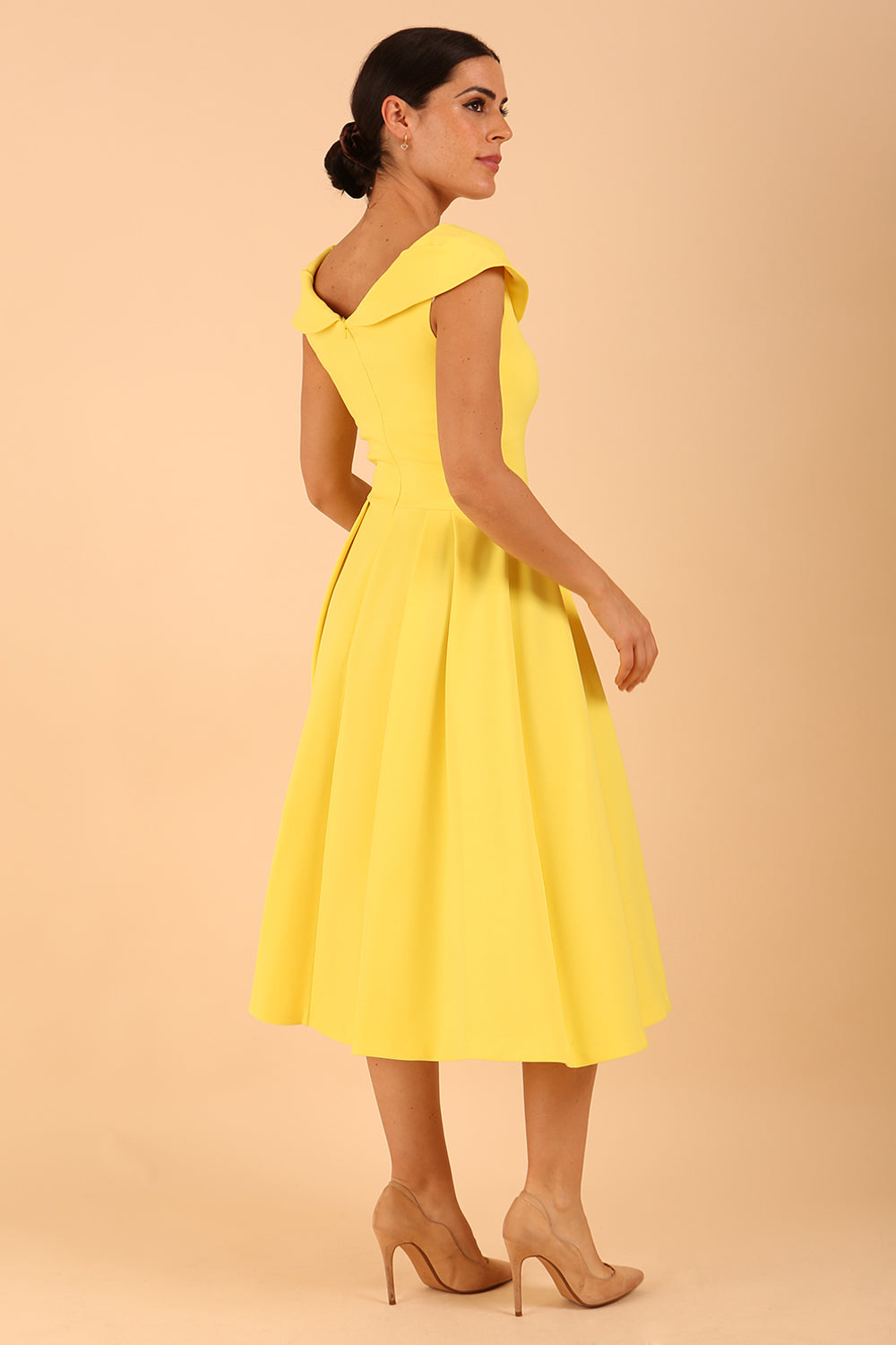 model is wearing divacatwalk Chesterton Sleeveless a-line swing dress in blazing yellow with oversized collar side back