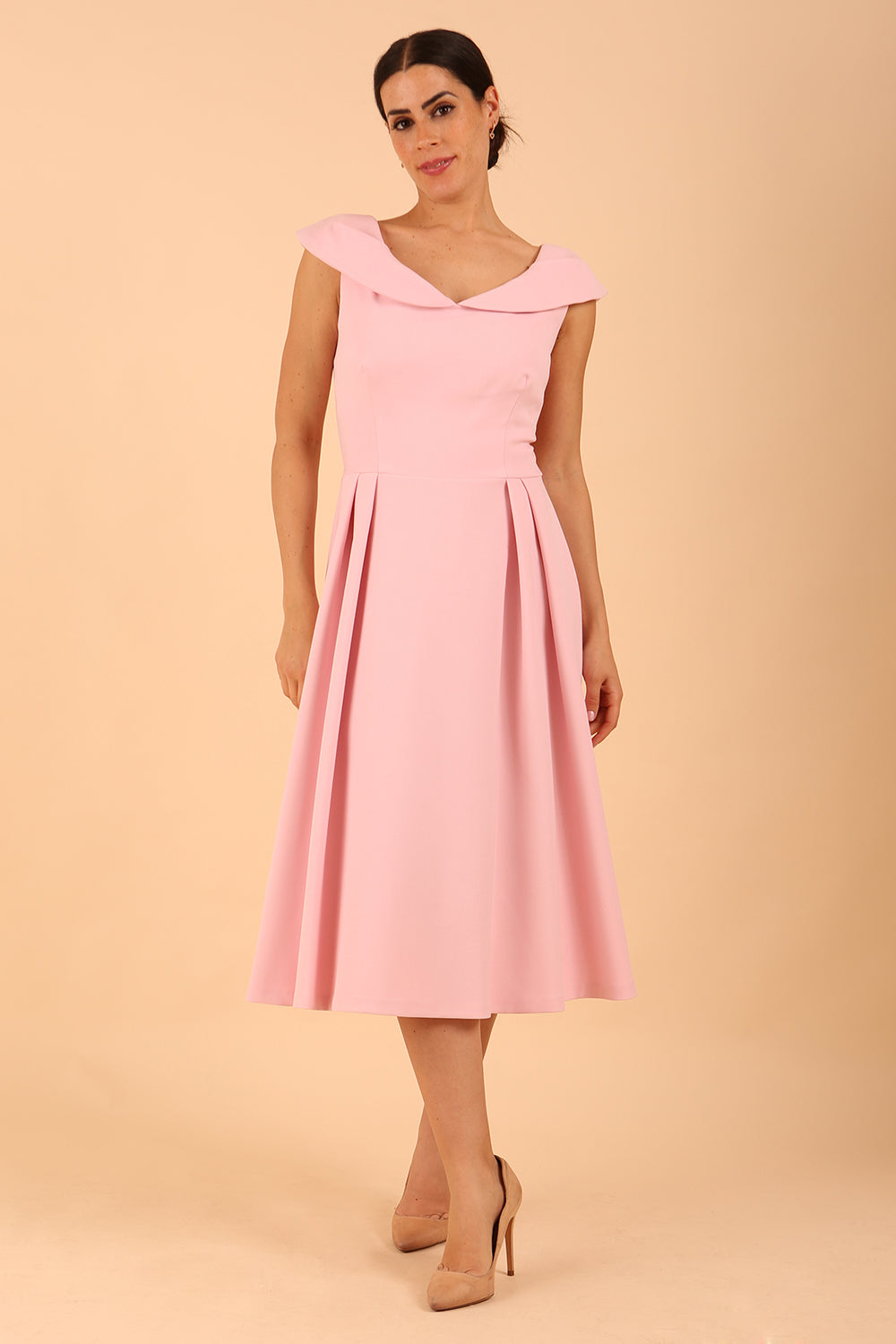 model is wearing divacatwalk Chesterton Sleeveless a-line swing dress in Crystal Pink with oversized collar front 