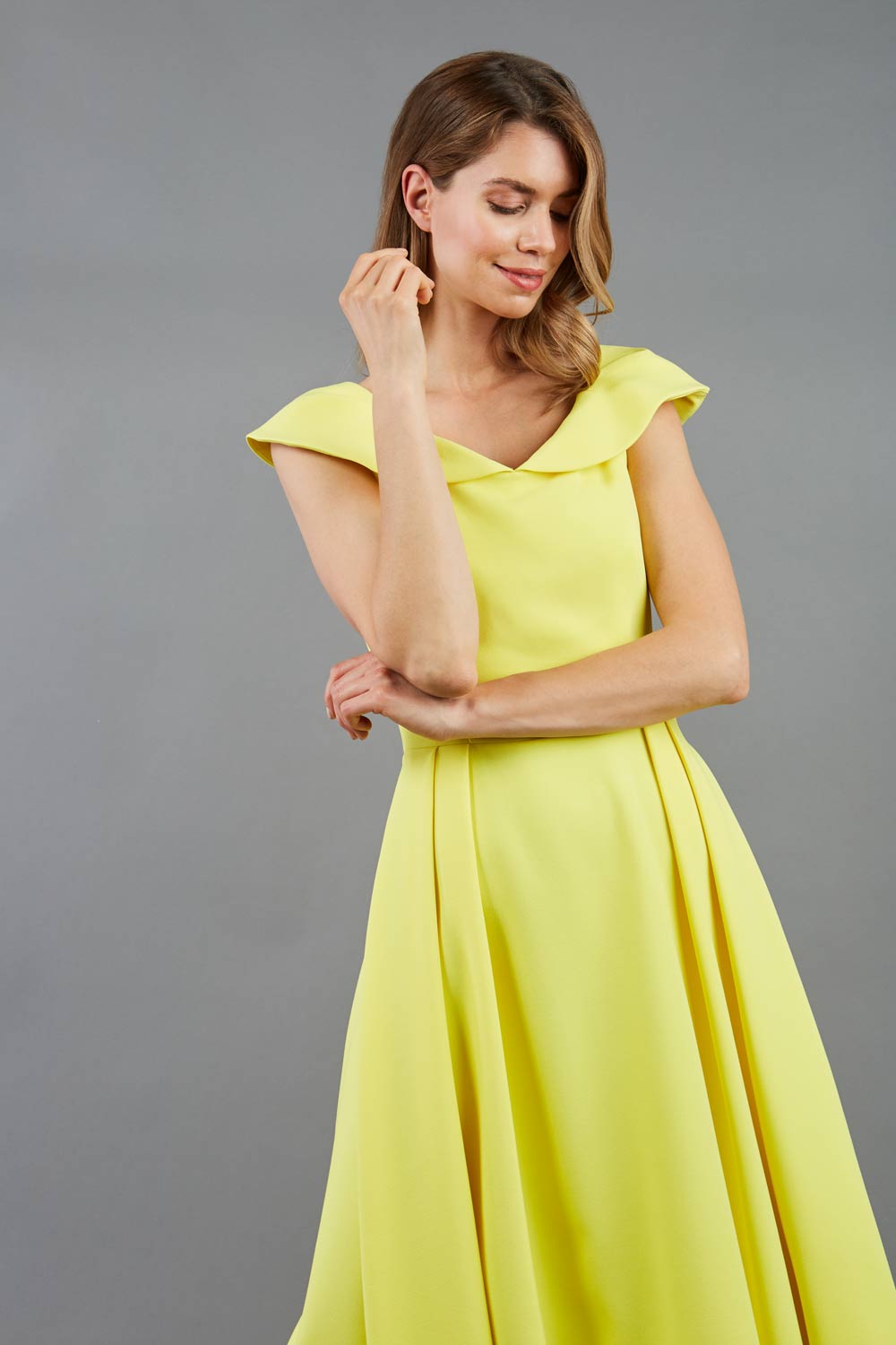 model is wearing divacatwalk Chesterton Sleeveless a-line swing dress in blazing yellow with oversized collar front