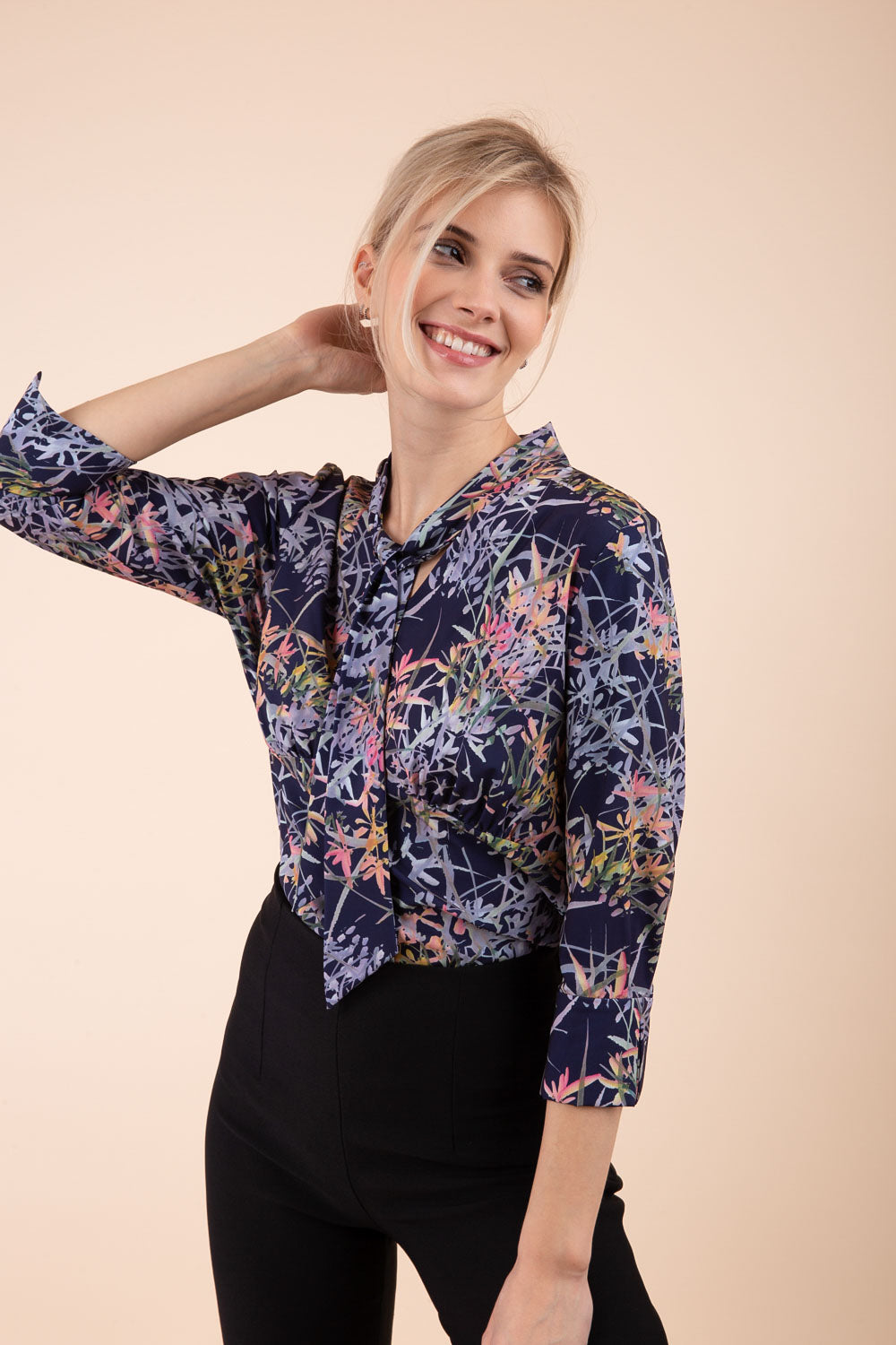 Model wearing the Diva floral top in navy blue front image