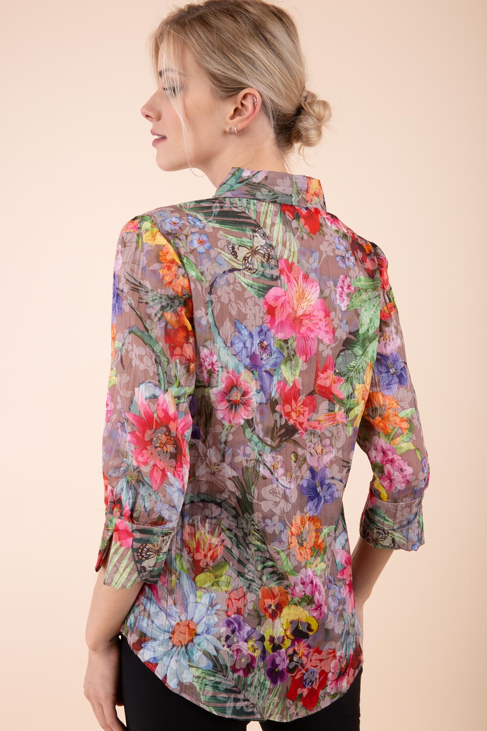 Model is wearing the Diva Branscombe 3/4 Sleeve blouse in floral print taupe back image 