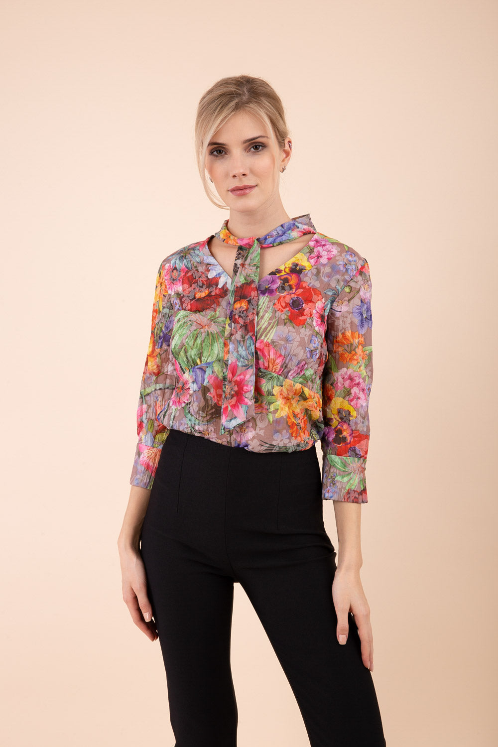 Model is wearing the Diva Branscombe 3/4 Sleeve blouse in floral print taupe front image 