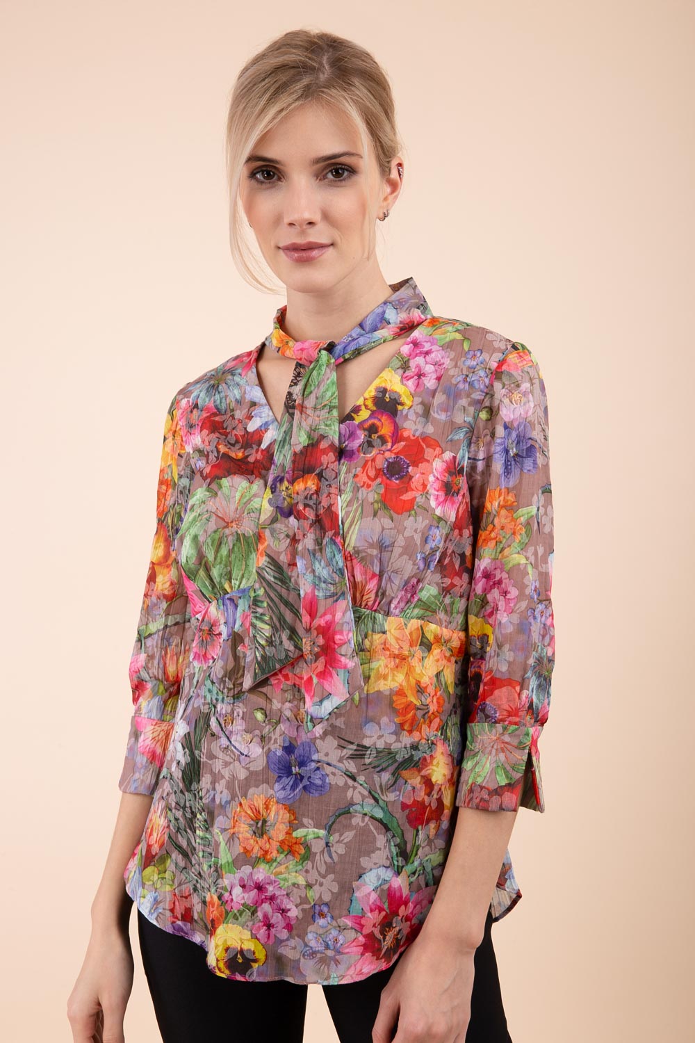 Model is wearing the Diva Branscombe 3/4 Sleeve blouse in floral print taupe front image 