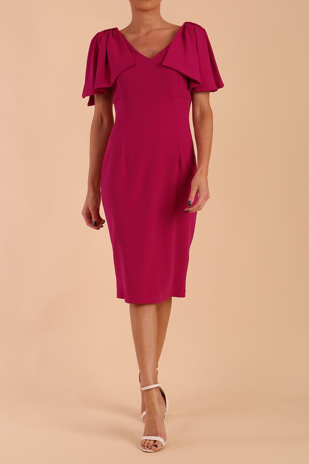 brunette model is wearing diva catwalk hermione pencil dress with tie shoulder details and empire waistline in magenta haze front