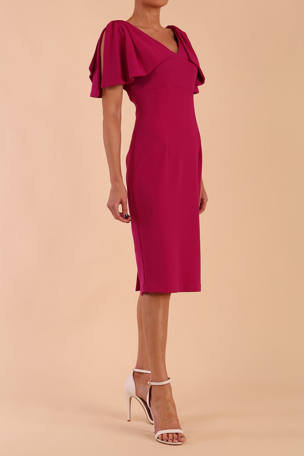 brunette model is wearing diva catwalk hermione pencil dress with tie shoulder details and empire waistline in magenta haze front side