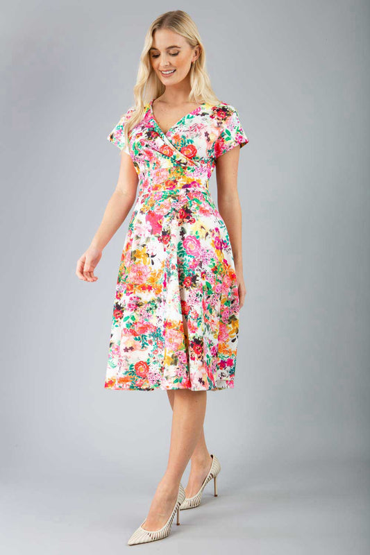 blonde model is wearing diva catwalk boston short sleeve v-neckline a-line swing dress in tearose print front