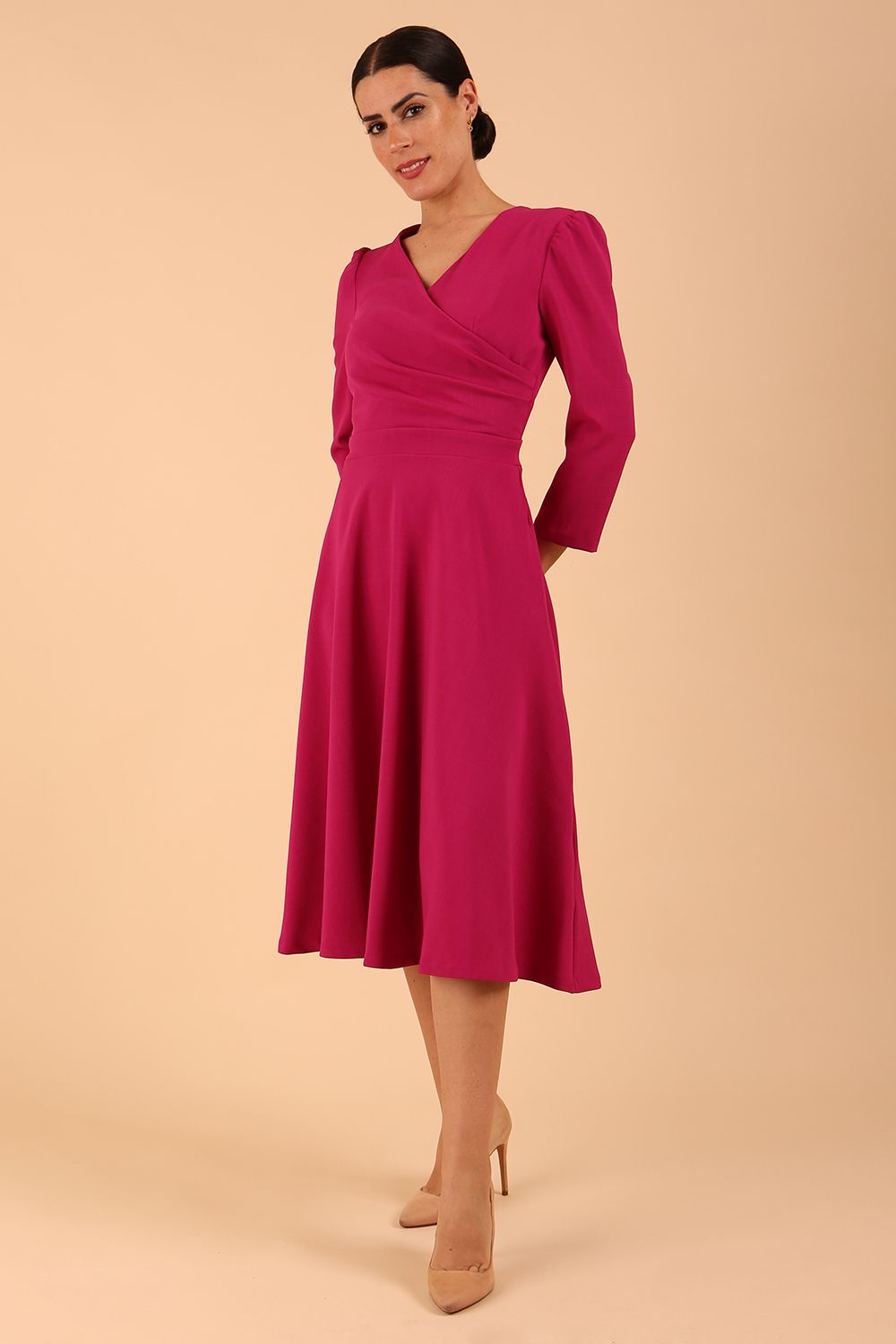 Model wearing diva catwalk Kate 3/4 Length Sleeve A-Line Swing Dress in Magenta Haze with pockets front