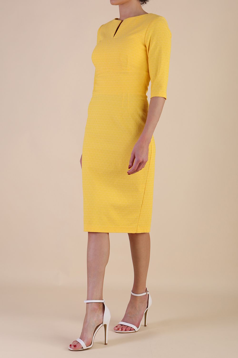 Model wearing diva catwalk Harriet Elbow Sleeve Knee Lenght Jacquard Dress in Lemon colour side