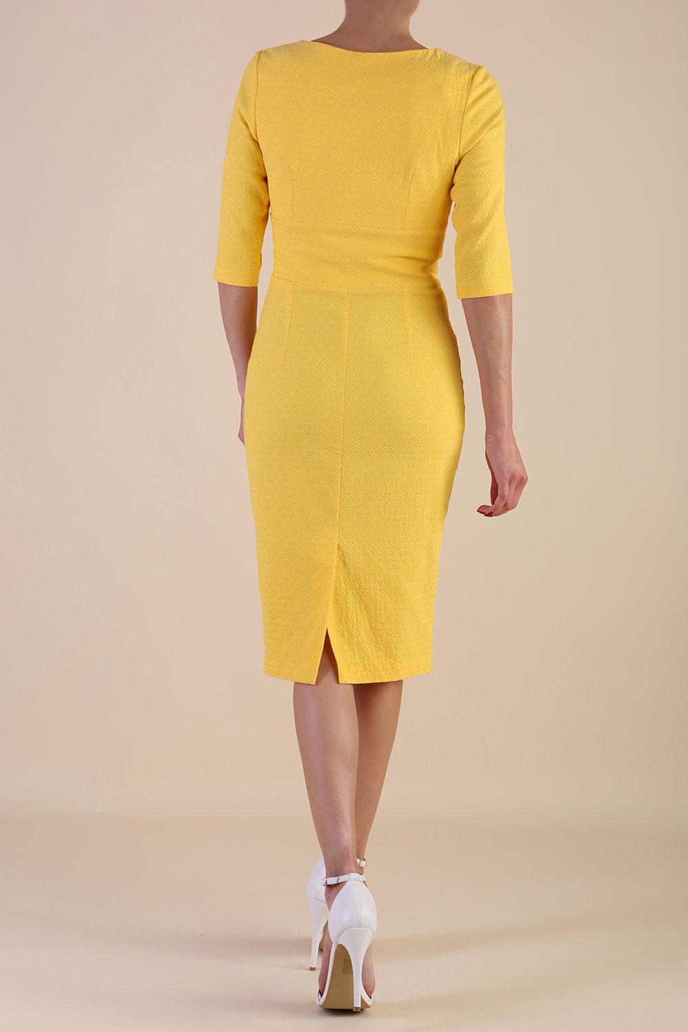 Model wearing diva catwalk Harriet Elbow Sleeve Knee Lenght Jacquard Dress in Lemon colour back