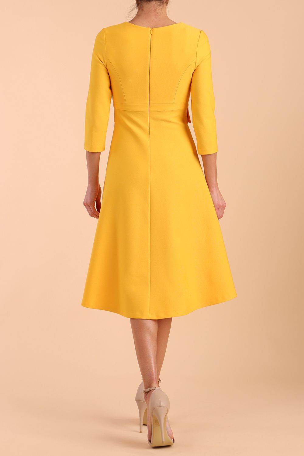 Model wearing diva catwalk Gresham 3/4 Sleeve Knee Length A-Line Dress in Daffodil Yellow back