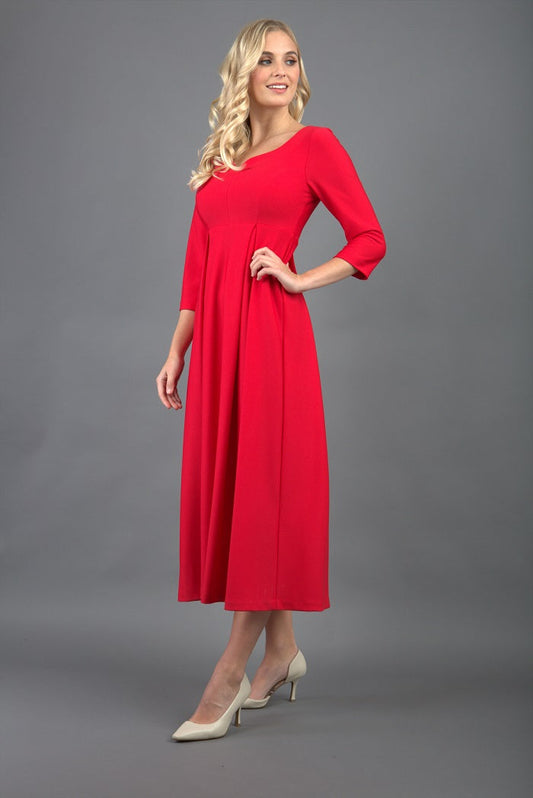 Brunette Model is wearing 3/4 sleeve sweetheart neckline swing electric red dress