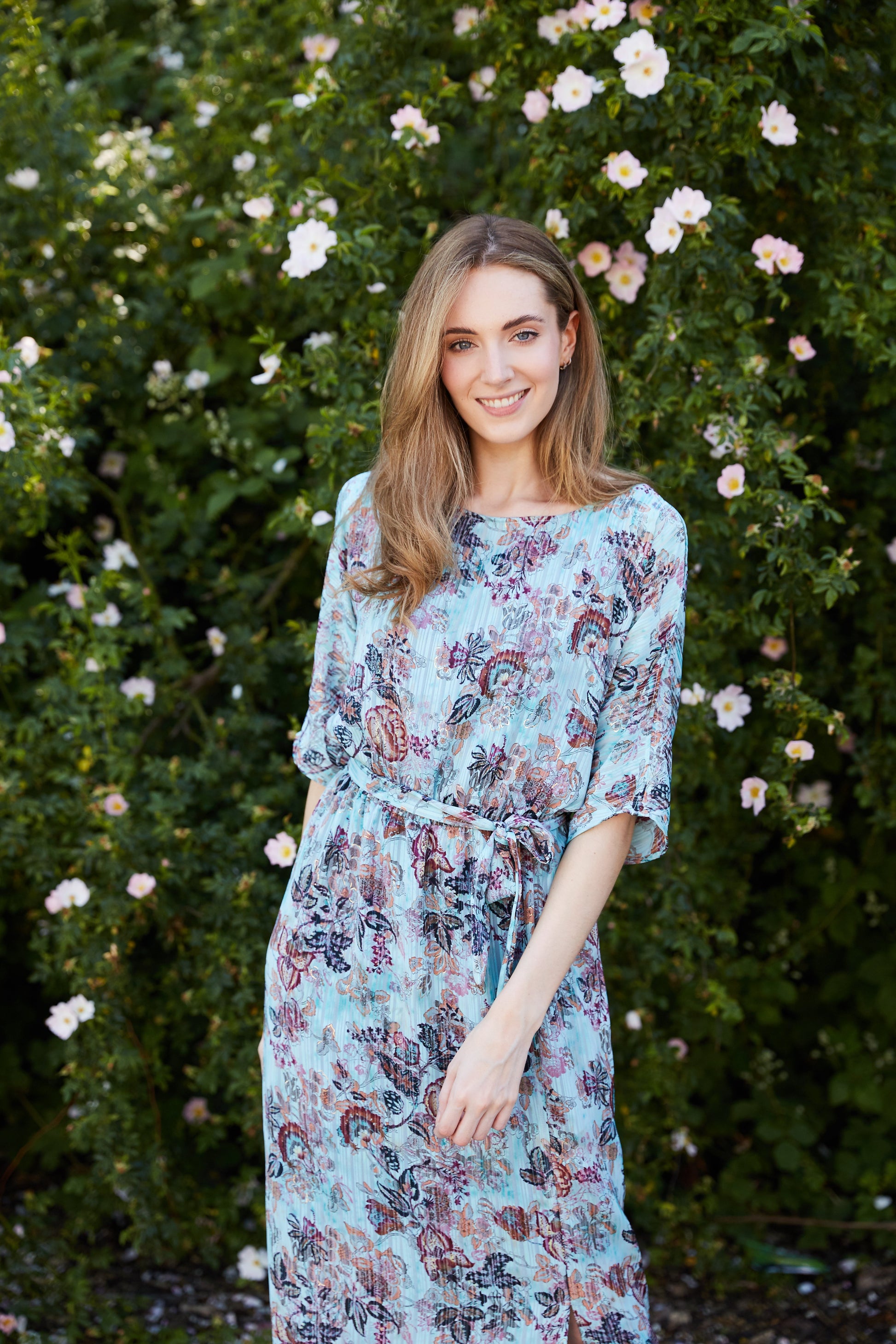 model is wearing diva catwalk maxi summer dress with short sleeve and a belt detail in pale blue print front