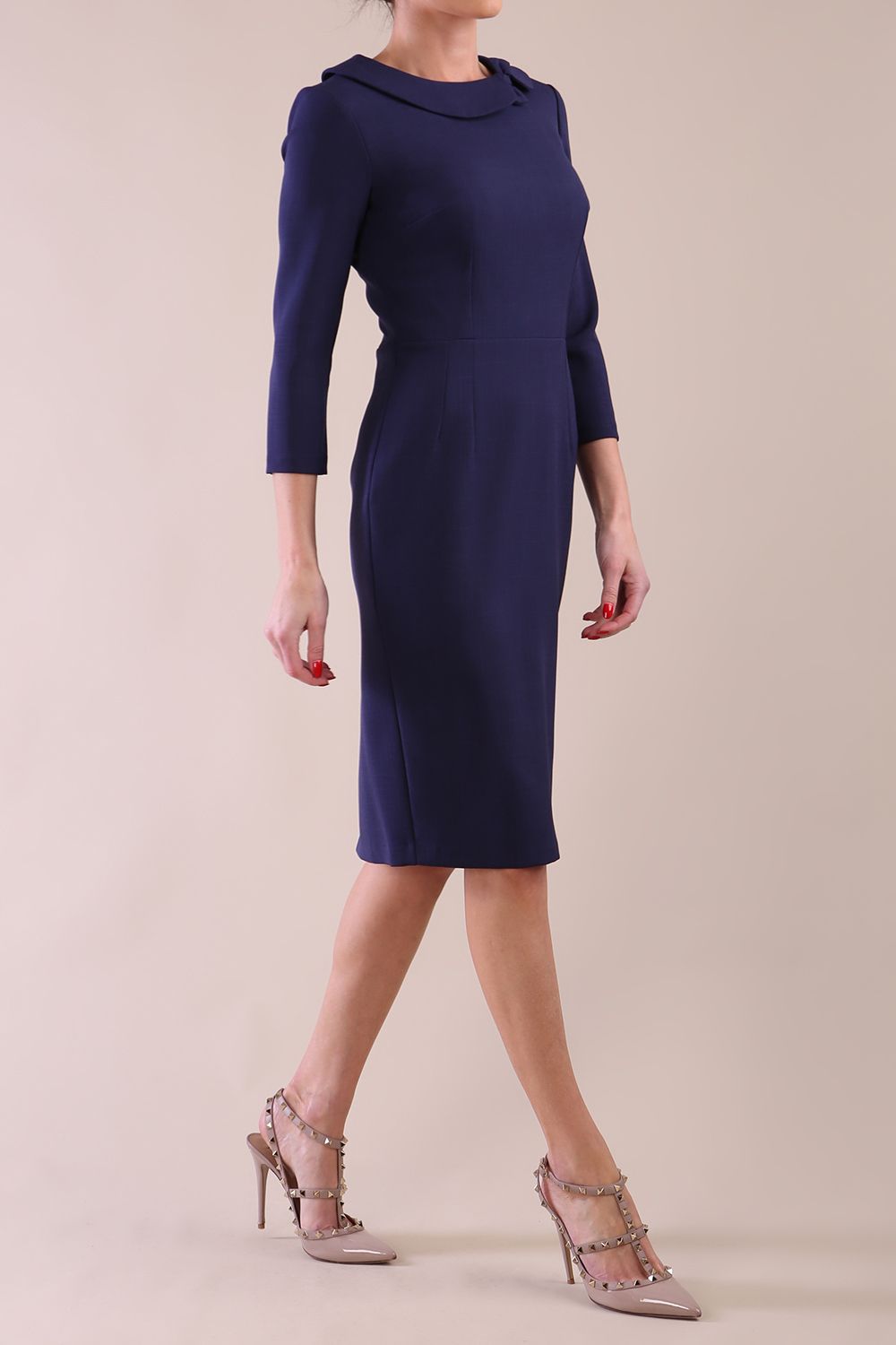 Model wearing diva catwalk Helium Sleeved pencil skirt dress in Navy Blue