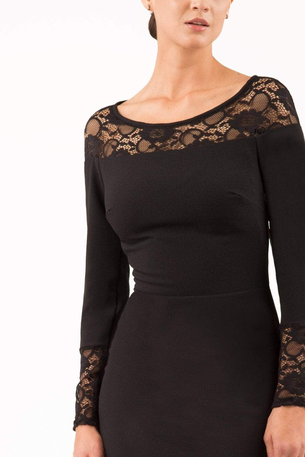 brunette model wearing diva catwalk black lace pencil dress with long sleeves and rounded lace neckline with the lace covering shoulders front